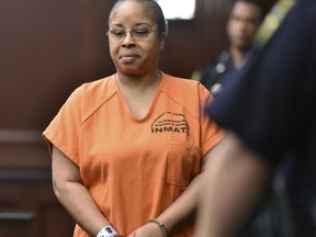 Gloria Williams enters the courtroom for her sentencing hearing, Friday, June 8, 2018, at the Duval County Courthouse in Jacksonville, Fla. Williams, who kidnapped a newborn from a Florida hospital two decades ago and raised the child as her own, was sentenced Friday to 18 years for kidnapping. She will also serve five years concurrently on a charge of custody interference.
