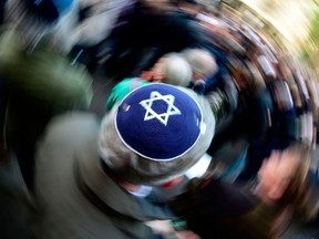 A man wears a Jewish cap during a "Berlin wears a kippah" rally held on April 25, 2018, in response to a series of recent anti-Semitic assaults.