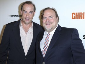 FILE - In this July 29, 2015, file photo, John Farley, left, and Kevin Farley arrive at the LA Premiere of "I Am Chris Farley" at the Linwood Dunn Theater in Los Angeles. The family of late comedian and film star Chris Farley has filed a federal lawsuit against Trek Bicycle for naming its fat-tired bikes Farley. The lawsuit alleges that the Wisconsin-based bike company misappropriated Farley's name and traded on his "fat guy" brand of comedy in 2013 when it gave the Farley name to its new fat-tired bikes. Chris Farley was born and raised in Madison, not far from Waterloo, where Trek is based.