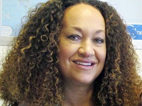 FILE - In this March 20, 2017, file photo, Nkechi Diallo, then known as Rachel Dolezal, poses at the bureau of The Associated Press in Spokane, Wash. A court hearing was postponed Wednesday, June 6, 2018, for the former NAACP leader in Washington state whose life unraveled after she was exposed as a white woman pretending to be black. Diallo pleaded not guilty last week through her attorney to charges including welfare fraud, perjury and false verification for public assistance.