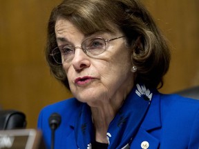 FILE - In this May 16, 2018 file photo Sen. Dianne Feinstein, D-Calif asks questions during a hearing of the Senate Judiciary Committee on Capitol Hill in Washington. In the U.S. Senate, contest the 26-year incumbent Feinstein is shifting to the left in the face of a challenge from state Sen. Kevin de Leon, who argues she's not done enough to stand up to Trump.