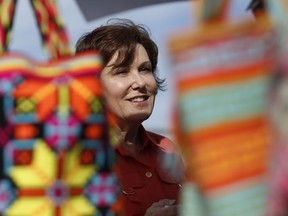 In this May 5, 2018, photo, Rep. Jacky Rosen, D-Nev., speaks with vendors at a Cinco de Mayo festival in North Las Vegas, Nev. Rosen is running for the U.S. Senate. The most closely-watched race in Nevada's primary election Tuesday, June 12, is the battle for governor. GOP Sen. Dean Heller now can expect to breeze through his primary and focus on readying for a November battle with Rosen, who is expected to easily win her party's backing Tuesday against five others.