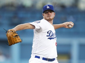 Los Angeles starting pitcher Caleb Ferguson throws to a Texas Rangers batter during the first inning of a baseball game Tuesday, June 12, 2018, in Los Angeles.