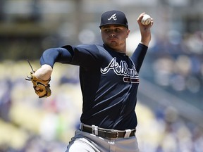 Atlanta Braves starting pitcher Sean Newcomb pitches to Los Angeles Dodgers' Chris Taylor during the first inning of a baseball game in Los Angeles, Sunday, June 10, 2018.