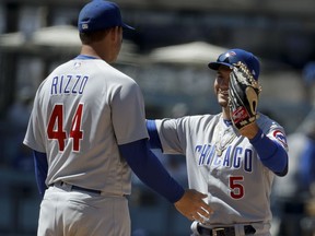 Chicago Cubs first baseman Anthony Rizzo, left, and center fielder Albert Almora Jr. celebrate their 11-5 win against the Los Angeles Dodgers during a baseball game in Los Angeles, Thursday, June 28, 2018.