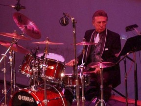 FILE- In this Oct. 16, 2004 file photo, longtime Elvis Presley drummer D.J. Fontana performs at the 50th anniversary celebration concert of Elvis Presley's first performance at the Louisiana Hayride in Sherveport, La.  Fontana, the drummer who helped launch rock 'n' roll as Elvis Presley's sideman, has died at 87, his wife said Thursday, June 14, 2018. Karen Fontana told The Associated Press that her husband died Wednesday, June 13 in his sleep in Nashville.