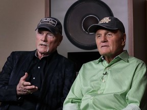 In this photo taken on Wednesday, June 13, 2018, Beach Boys musicians Mike Love, left, and Bruce Johnston, right, during an interview with Associated Press at Spiritland in London. The Beach Boys have a new CD with the Royal Philharmonic Orchestra that gives a classical twist to their sunny 1960s hits. Classics like 'Good Vibrations' and 'Wouldn't It Be Nice' mix the band's vocals with orchestral backing in an approach that's worked earlier for tunes by Elvis Presley, Roy Orbison and Aretha Franklin.