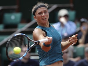 FILE - In this Sunday, May 27, 2018 file photo, Italy's Sara Errani returns the ball to France's Alize Cornet during their first round match of the French Open tennis tournament at the Roland Garros Stadium, in Paris. 2012 French Open finalist Sara Errani's doping suspension has been increased from two months to 10 months by the Court of Arbitration for Sport. CAS announced on Monday, June 11, its rulings in appeals by Errani and Italy's national anti-doping agency, which asked for up to a two-year punishment.