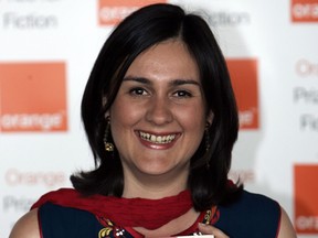 FILE - In this Wednesday June 3, 2009 file photo, author Kamila Shamsie poses for the photographers ahead of the announcement of the 2009 Orange Book prize for fiction, in London's Royal Festival Hall. British-Pakistani writer Kamila Shamsie has won the international Women's Prize for Fiction with "Home Fire," a novel about love, radicalism and conflicting loyalties in the post-9/11 era. Shamsie was awarded the 30,000 pound ($40,000) prize at a ceremony in London Wednesday, June 6, 2018.