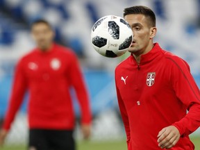 FILE - In this Thursday, June 21, 2018 file photo, Serbia's Dusan Tadic watches the ball at the official training session of the Serbian team at the 2018 soccer World Cup at Kaliningrad stadium in Kaliningrad, Russia. Serbia's World Cup midfielder Dusan Tadic is leaving Southampton next month to join former European Cup champion Ajax. "Southampton Football Club can confirm that Dusan Tadic has agreed a move to Ajax for an undisclosed fee," the Premier League club said on Wednesday, June 27, 2018. "The transfer sees the 29-year-old move back to the Dutch top flight four years after joining Saints from FC Twente."