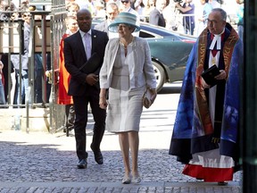 Britain's Prime Minister Theresa May arrives to attend a Service of Thanksgiving to celebrate the contribution of immigrants from the Caribbean and to mark the 70th anniversary of the landing of the ship Empire Windrush, at Westminster Abbey in London, Friday, June 22, 2018. Friday's anniversary comes weeks after the government apologized over its treatment of people from the Caribbean wrongly identified as living in Britain illegally.