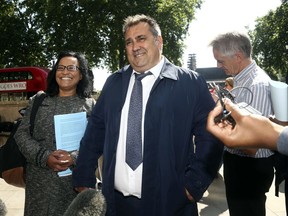 Former Pimlico Plumbers employee Gary Smith leaves the UK Supreme Court, Parliament Square, London, Wednesday, June 13, 2018. A London plumber who claimed he was unfairly dismissed after years of working as a contractor has won a court ruling giving him employment rights, in a case seen as a key test of labor rules in the so-called gig economy. Britain's Supreme Court upheld a ruling by a lower court saying that Gary Smith, who worked for Pimlico Plumbers full-time for six years, was entitled to rights such as sick pay.