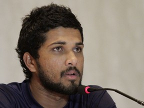 FILE - In this Thursday, Nov. 9, 2017 file photo, Sri Lanka's Dinesh Chandimal attends a press conference prior to their cricket series against India in Kolkata, India. Sri Lanka's captain, coach, and manager have admitted to breaching the "spirit of cricket" by refusing to play the West Indies for two hours during the second test in St. Lucia. Captain Dinesh Chandimal, coach Chandika Hathurusinghe and manager Asanka Gurusinha admitted to the charge laid by International Cricket Council chief executive David Richardson following the test.