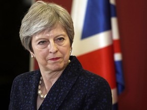FILE - In this Thursday, May 17, 2018 file photo, British Prime Minister Theresa May looks on during a news conference with her Macedonian counterpart Zoran Zaev, not pictured, following their meeting at the government building in Skopje, Macedonia. British Prime Minister Theresa May is urging feuding Conservative lawmakers to unite and prevent the government from being defeated in key votes on its main Brexit bill. The European Union Withdrawal Bill, intended to enact Britain's exit from the bloc, has had a rocky ride through Parliament. The House of Lords has inserted 15 amendments to soften the terms of Britain's departure.