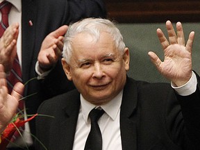 FILE - In this Dec. 7, 2017 file photo, Jaroslaw Kaczynski, the powerful leader of Poland's ruling Law and Justice party, waves after the government survived a no-confidence vote at the parliament building in Warsaw, Poland. The head of a Warsaw hospital said Friday June 8, 2018, the leader of Poland's ruling party, Jaroslaw Kaczynski, has been discharged following treatment that has "stabilized his health condition."