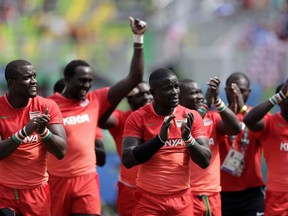FILE - In this Thursday, Aug. 11, 2016 file photo, Kenya players acknowledge the supporters at the end of their men's rugby sevens match against Brazil at the Summer Olympics in Rio de Janeiro, Brazil. The Kenya Rugby Union was forced to rehire national sevens coach Innocent Simiyu on Monday June 25, 2018, four days after sacking him in a payments dispute.