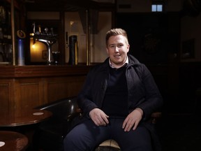 In this photo taken on Wednesday, March 21, 2018, Football Lads Alliance leader John Meighan poses for a photograph before giving an interview with The Associated Press in a pub in London. A property manager and fan of the soccer team Tottenham Hotspur, John Meighan envisioned a group bringing together working-class people who felt excluded from political influence - to stand up in opposition, not to Muslims or Islam, but to extremism. It didn't quite work out that way, as the Football Lads Alliance found itself drawn into the orbit of Britain's growing far-right.