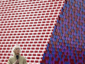 Artist Christo speaks during the unveiling of his first UK outdoor exhibit, The London Mastaba, on the Serpentine Lake in Hyde Park, central London, Monday June 18, 2018. The sculpture consists of 7,506 horizontally stacked barrels on a floating platform in the lake.