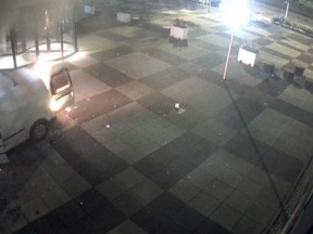 This image taken from a security camera video made available by De Telegraaf on Tuesday June 26, 2018, shows a van on fire outside the De Telegraaf building. A man rammed a van into the Amsterdam headquarters of one of the Netherlands' major national newspapers before setting the vehicle alight Tuesday, an attack that the Dutch prime minister called "a slap in the face of a free press and Dutch democracy." (De Telegraaf via AP)