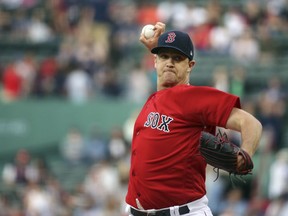 Boston Red Sox starting pitcher Steven Wright delivers to the Seattle Mariners during the first inning of a baseball game at Fenway Park, Friday, June 22, 2018, in Boston.