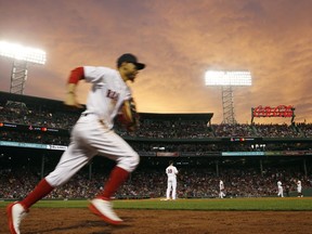 Boston Red Sox's Mookie Betts takes the field at the top of the fifth inning of the team's baseball game against the Los Angeles Angels in Boston, Thursday, June 28, 2018.