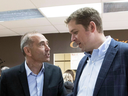 Saguenay-Le Fjord candidate Richard Martel chats with Conservative Leader Andrew Scheer on June 14, 2018 in Saguenay, Quebec. Martel defeated his Liberal opponent to win the riding on Monday night.