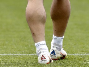 Switzerland's Xherdan Shaqiri wears soccer shoes with the national flags of Switzerland and Kosovo at the official training session of the Swiss team one the eve of the group E match between Switzerland and Serbia at the 2018 soccer World Cup at Kaliningrad stadium in Kaliningrad, Russia, Thursday, June 21, 2018.