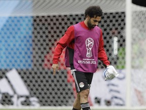Egypt's Mohamed Salah leaves the field after the group A match between Egypt and Uruguay at the 2018 soccer World Cup in the Yekaterinburg Arena in Yekaterinburg, Russia, Friday, June 15, 2018.