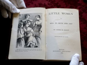 In this May 17, 2018 photo, an illustration and title page to the book Little Women, by Louisa May Alcott, appear in an 1869 edition of the book at Orchard House, in Concord, Mass. Since "Little Women" was published 150 years ago, the coming of age book has been translated into over 50 languages.