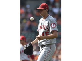 Los Angeles Angels pitcher Tyler Skaggs tosses the ball after giving up two runs to the Baltimore Orioles in the first inning of baseball game, Saturday, June 30, 2018, in Baltimore.
