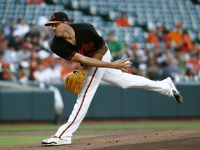 Baltimore Orioles starting pitcher Kevin Gausman follows through to the Miami Marlins in the first inning of a baseball game, Friday, June 15, 2018, in Baltimore.