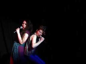 In this May 1, 2018 photo, Melanie Pino-Elliott, left, and Katrina Jackson perform during a Music and Drama Club dress rehearsal for the musical "Weird Romance" at NASA's Goddard Space Flight Center in Greenbelt, Md.