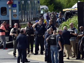 Police secure the scene of a shooting in Annapolis, Md., Thursday, June 28, 2018. A single shooter killed several people Thursday and wounded others at a newspaper in Annapolis, Maryland, and police said a suspect was in custody.