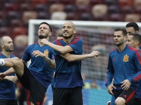 Spain's David Silva, center, exercises with teammates during Spain's official training ahead of the round of 16 match between Russia and Spain at the 2018 soccer World Cup at the Luzhniki Stadium in Moscow, Russia, Saturday, June 30, 2018.