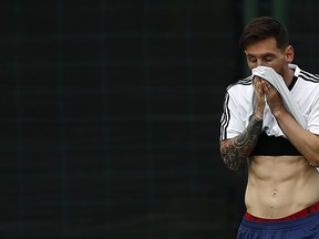 Argentina's Lionel Messi wipes his face during a team training session at the Sports Center FC Barcelona Joan Gamper, in Sant Joan Despi, Spain, Wednesday, June 6, 2018. Argentina has called off a World Cup warmup match against Israel following protests by pro-Palestinian groups. A source at Argentina's football federation on Tuesday confirmed the cancellation of the international friendly scheduled to be played Saturday at Teddy Kollek Stadium in Jerusalem.