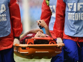 Denmark's William Kvist leaves the field injured during the group C match between Peru and Denmark at the 2018 soccer World Cup in the Mordovia Arena in Saransk, Russia, Saturday, June 16, 2018.