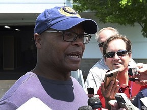 Mike Singletary, former NFL football player and coach, talks to reporters with visiting the Detroit Lions' practice in Allen Park, Mich., Thursday, June 7, 2018. Singletary hopes to coach again in the NFL someday. He has plenty on his plate right now, though. He said he doesn't know Lions coach Matt Patricia that well, but he wanted to be there to check out the video screens Detroit is using at practice. Singletary was hired earlier this year to coach high school football at Trinity Christian Academy in Texas.