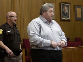 FILE - In this May 1, 2018, file photo, Charles Pickett Jr., of battle Creek, Mich., enters a courtroom in Kalamazoo moments before 14 counts of "guilty" are read as the verdict in his murder trial for the deaths of five bicyclists and severe injuries to four others stemming from the June 7, 2016 crash on a rural road in Cooper Township, Mich. Pickett is scheduled to be sentenced Monday, June 11, 2018.