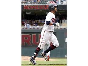 Minnesota Twins' Eddie Rosario jogs home on a solo home run off Cleveland Indians' pitcher Mike Clevinger in the first inning of a baseball game Sunday, June 3, 2018, in Minneapolis.