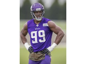 FILE - In this June 12, 2018, file photo, Minnesota Vikings defensive end Danielle Hunter watches during NFL football practice, in Eagan, Minn. The Vikings have agreed to terms on a contract extension with Danielle Hunter, securing another core player before he can reach free agency. The Vikings announced the deal on Wednesday, June 27, 2018.