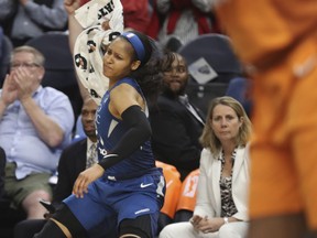 Minnesota Lynx's Maya Moore celebrates a basket by Tanisha Wright against the Phoenix Mercury during the first half of a WNBA basketball game Friday, June 1, 2018, in Minneapolis.