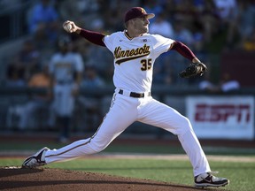 Minnesota pitcher Reggie Meyer throws to a Canisius batter during the first inning of an NCAA college baseball tournament regional game Friday, June 1, 2018, in Minneapolis.