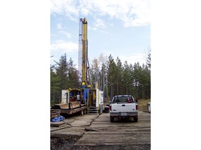 FILE - In this Oct. 4, 2011, file photo, a prospecting drill rig bores into the bedrock near Ely, Minn., in search of copper, nickel and precious metals that Twin Metals Minnesota LLC, hopes to mine near the Boundary Waters Canoe Area Wilderness in northeastern Minnesota. Nine Minnesota businesses that rely on the Boundary Waters Canoe Area sued the Interior Department and its Bureau of Land Management on Thursday, June 21, 2018, challenging their decision to reinstate the federal mineral rights leases for the proposed Twin Metals copper-nickel mine.