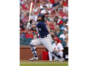 San Diego Padres' Freddy Galvis watches his two-run double during the first inning of a baseball game against the St. Louis Cardinals on Wednesday, June 13, 2018, in St. Louis.