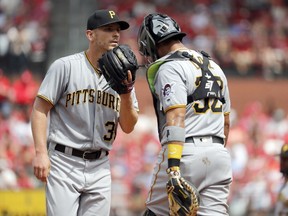 Pittsburgh Pirates starting pitcher Chad Kuhl, left, talks on the mound with catcher Elias Diaz during the fifth inning of a baseball game against the St. Louis Cardinals Saturday, June 2, 2018, in St. Louis.