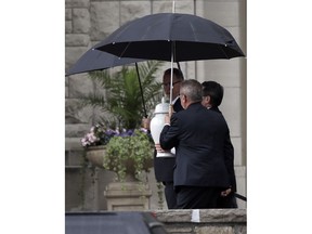 Funeral directors carry the remains of Kate Spade into services at Our Lady of Perpetual Help Redemptorist Catholic Church in Kansas City, Mo., Thursday, June 21, 2018.