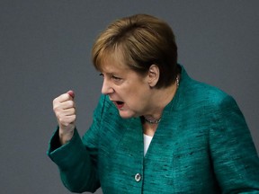 German Chancellor Angela Merkel delivers her speech during a debate at the German parliament Bundestag in Berlin, Thursday, June 28, 2018.