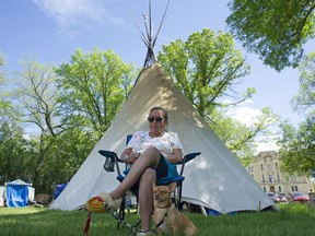 Debbie Baptiste, mother of the late Colten Boushie, sits at the "Justice For Our Stolen Children" camp near the Saskatchewan Legislature Building in Regina on Tuesday, June 12, 2018.