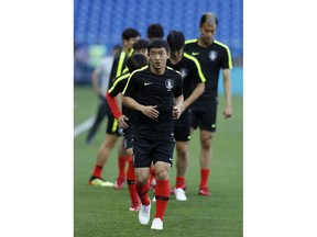 South Korea's Kim Min-woo warm up during South Korea's official training on the eve of the group F match between South Korea and Mexico at the 2018 soccer World Cup at the Rostov Arena, in Rostov-on-Don, Russia, Friday, June 22, 2018.