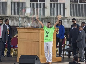 Ethiopia's Prime Minister Abiy Ahmed waves to the crowd at a large rally in his support, in Meskel Square in the capital, Addis Ababa, Ethiopia Saturday, June 23, 2018. A deadly explosion struck the huge rally for Ethiopia's reformist new prime minister on Saturday shortly after he spoke and was waving to the crowd that had turned out in numbers unseen in recent years in the East African nation.